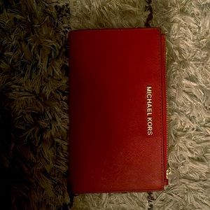 a Michael Kors wallet that I  used maybe 4 times if that! Super cute good care!